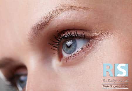 I often see patients who complain about looking older than they feel, or of being told they “look tired all the time.” Eyelid (or blepharoplasty) surgery can make a tremendous improvement to a person’s appearance, giving them a younger, fresher look. When would someone consider having a blepharoplasty (eyelid surgery)? A blepharoplasty is usually used to treat excessive eyelid skin, bags around the eyes, or to reduce the effects of aging. This procedure typically involves removal of sagging skin of the upper or lower, or both eyelids. Oftentimes, the fat around the eye bulges with age. If this is the case, the excess fat is either removed or repositioned. A droopy brow is generally part of, if not the entire problem, creating the illusion of excessive eyelid skin. For best results, the eyelids and brow must really be considered together. It is important to mention that a blepharoplasty will not remove dark pigmentation under the eyes, nor will it completely eliminate lines such as ‘crow’s feet’. Adjunctive treatments can be helpful for those problems. In your consultation, I will discuss your desired outcome, as well as evaluate the shape of your eyes, symmetry, and the proportion of the tear troughs in relation to the cheeks. A surgical plan will be carefully developed, while your pre and post operative expectations are discussed. It is very important to assess the position of the eyebrow. What is the typical recovery time with eyelid surgery? Blepharoplasty is typically a day surgery and is performed either under general anaesthetic, or heavy sedation and local anaesthesia. The operation takes between one and two hours. The recovery is generally straightforward. Bruising and swelling improves significantly over the first seven to ten days, resolving entirely by up to three months. I recommend taking two weeks off work, and if you have an important event coming up, try to allow six weeks recovery. Incisions are placed in skin creases and are barely perceptible after they have healed. Walking is encouraged, but no heavy exercise should be performed for one month. The results of this procedure are fairly immediate, however, as the face ages revisions may be necessary. You should expect the benefits to last for 10 to 15 years, depending on what has been done. Eyelid surgery is very common and the results can be excellent. It is important to choose a surgeon that you are comfortable with, who has taken the time to assess your entire eye region, including your brow, lids, and cheek. To book a private consultation with Dr Shortt please call 905-849-4282 or click here As seen in Spa Life Magazine: Ask the Experts Blepharoplasty